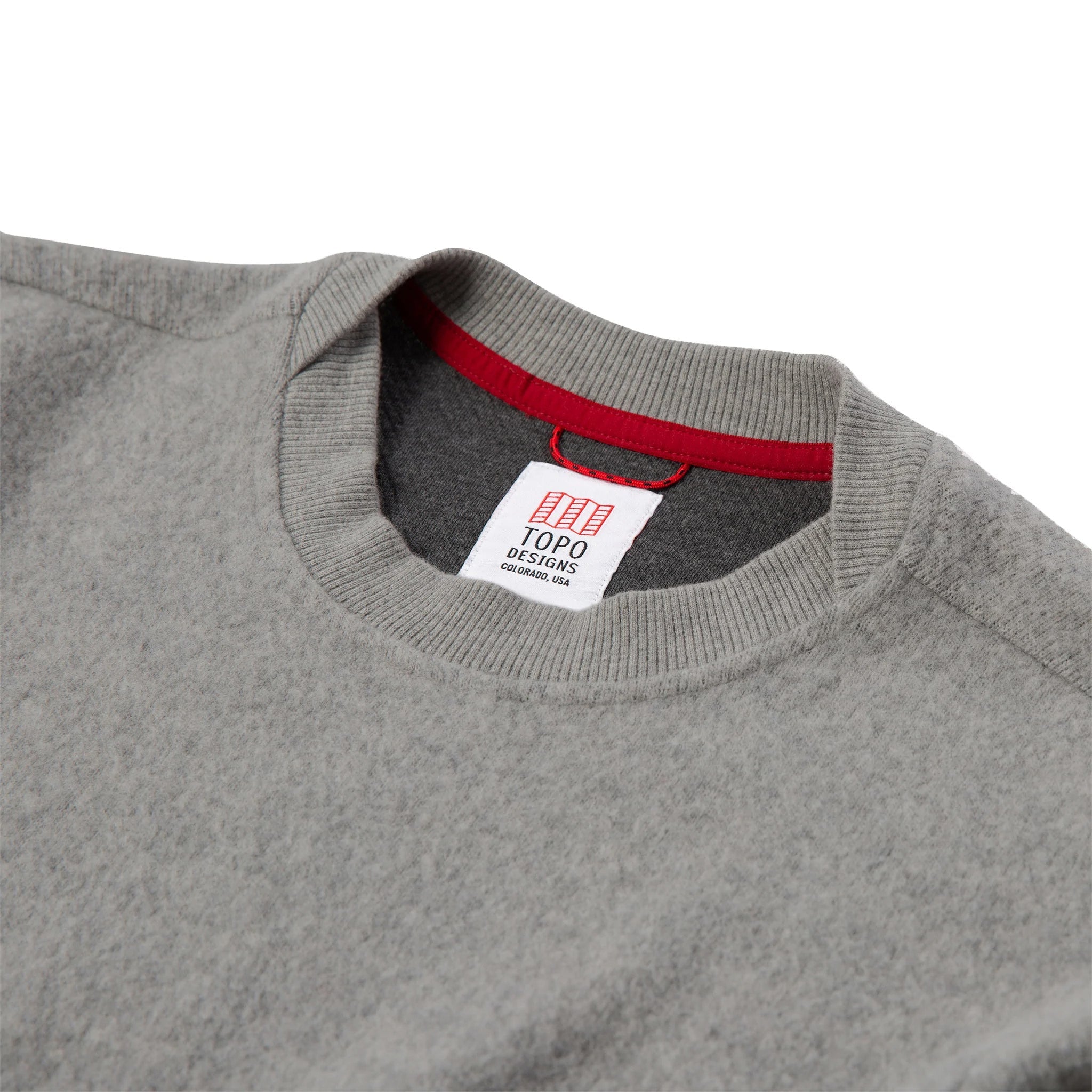 General detail shot of women's global sweater in gray showing neck hem.