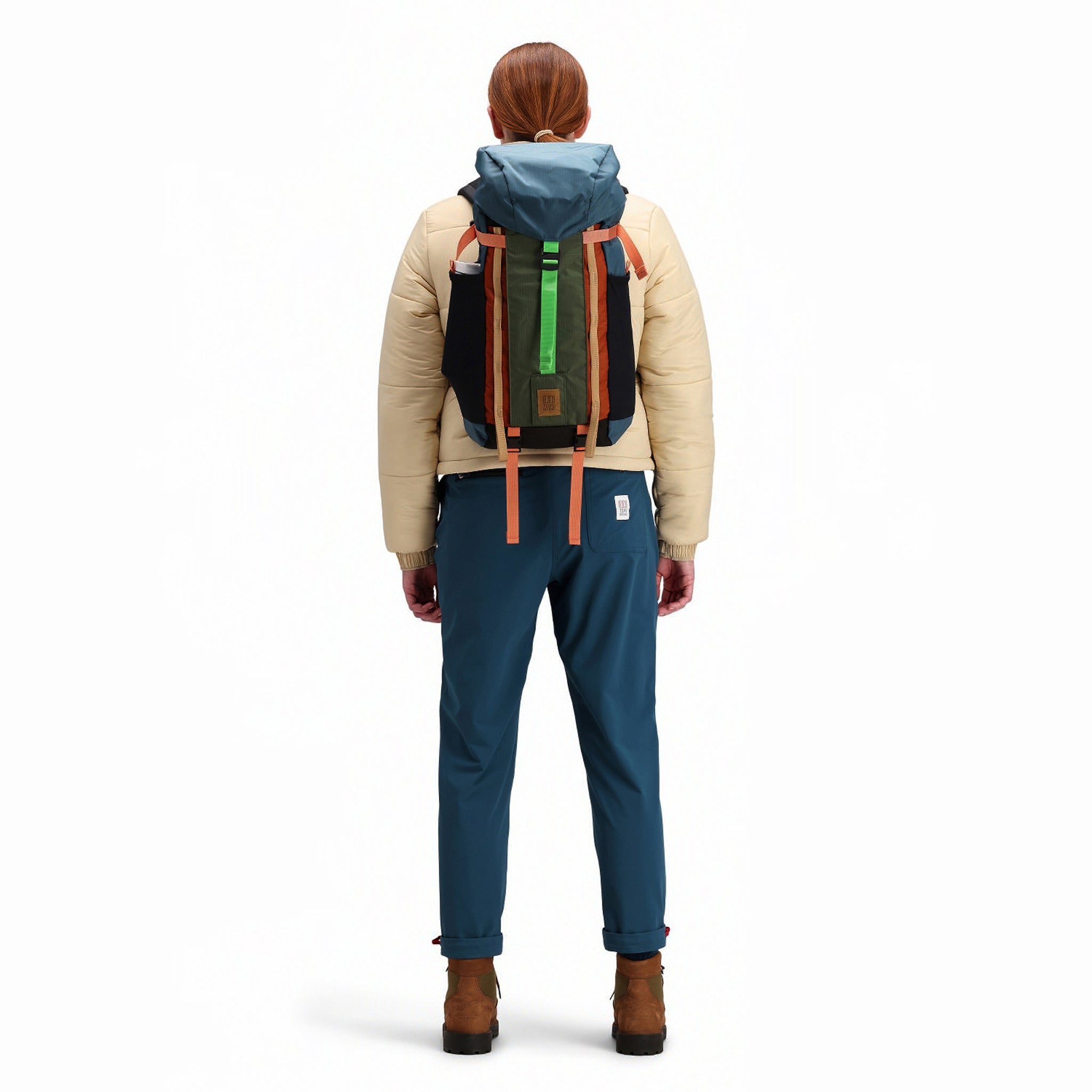 Back model shot of Topo Designs Mountain Pack 16L hiking backpack with internal laptop sleeve in lightweight recycled nylon "Pond Blue / Olive" green. Show on "Hemp / Bone Brown" and "Red / Turquoise"