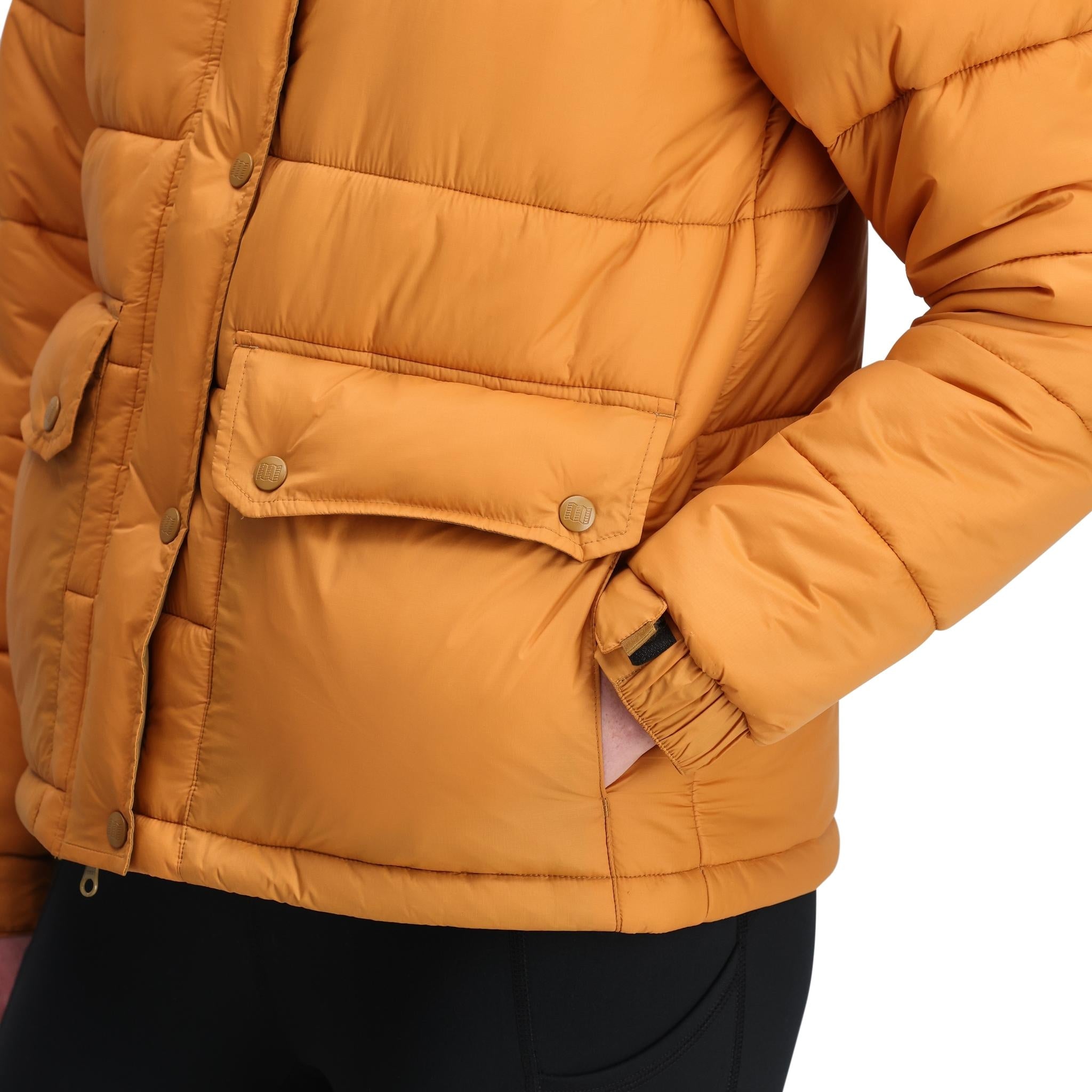 Detail shot of Topo Designs Retro Ridge Puffer Jacket - Women's  in "Dark Khaki / Spice"