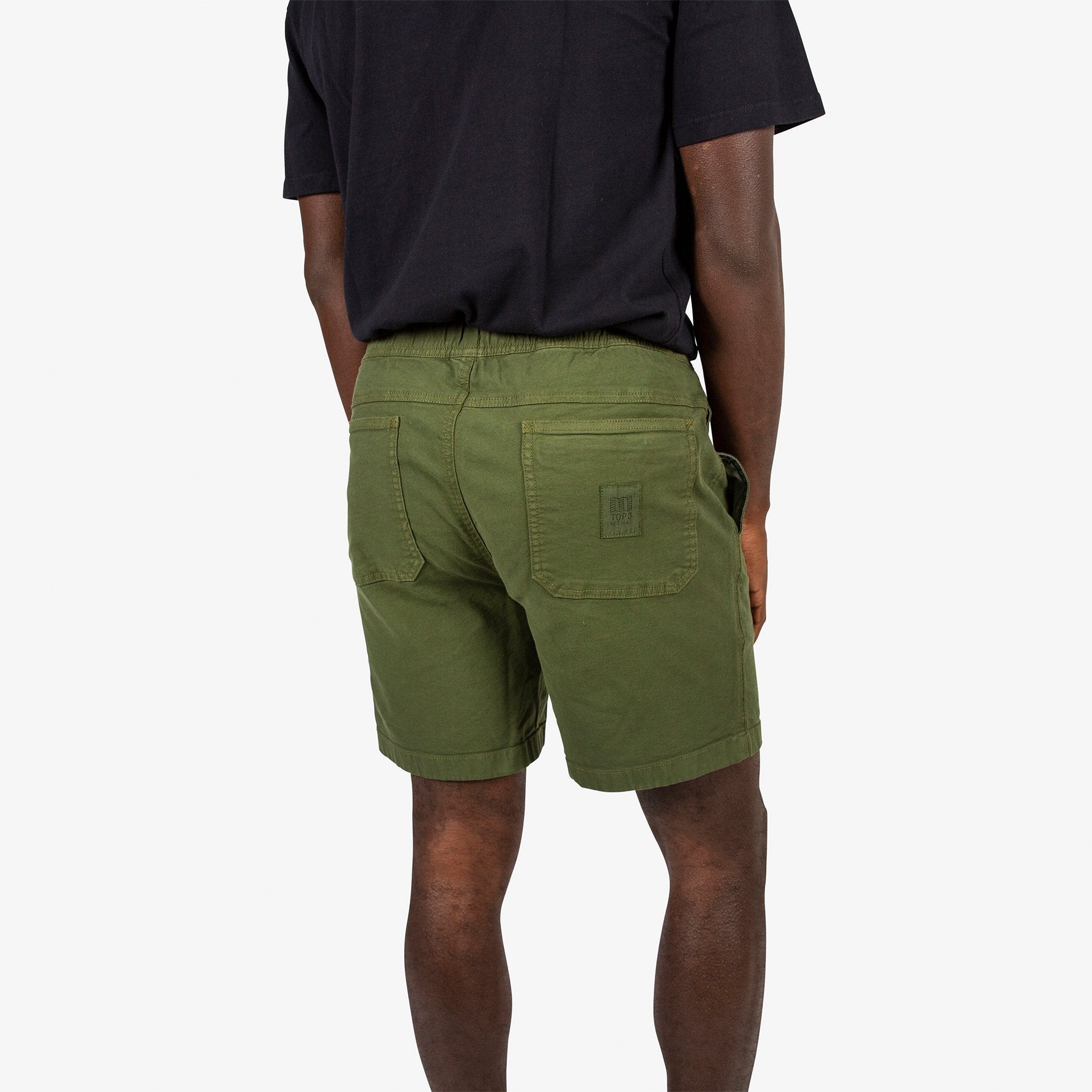 Topo Designs Men's drawstring Dirt Shorts in "Olive" green on model.