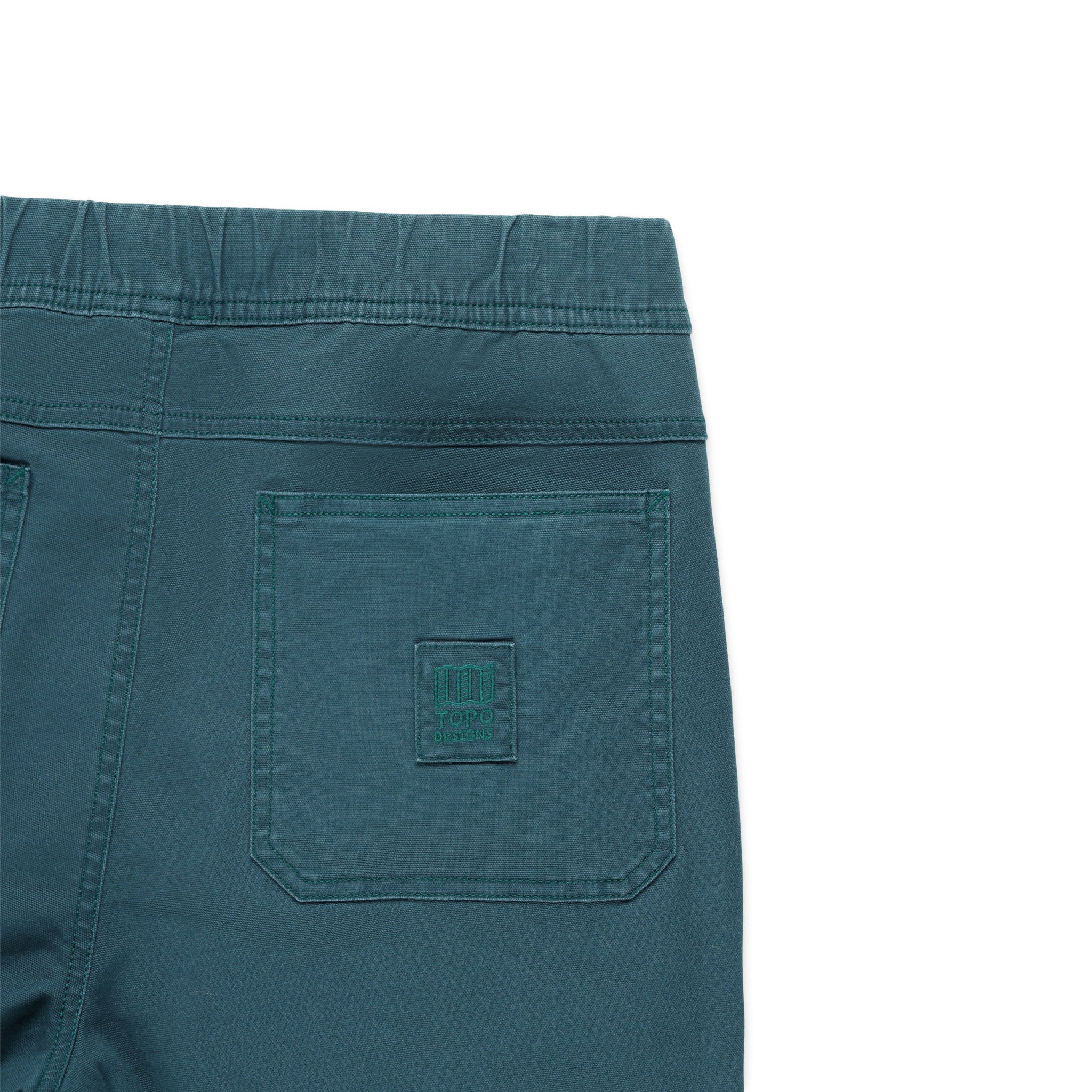 General shot of back pocket and logo patch detail on Topo Designs Men's drawstring Dirt Shorts 100% organic cotton in pond blue.