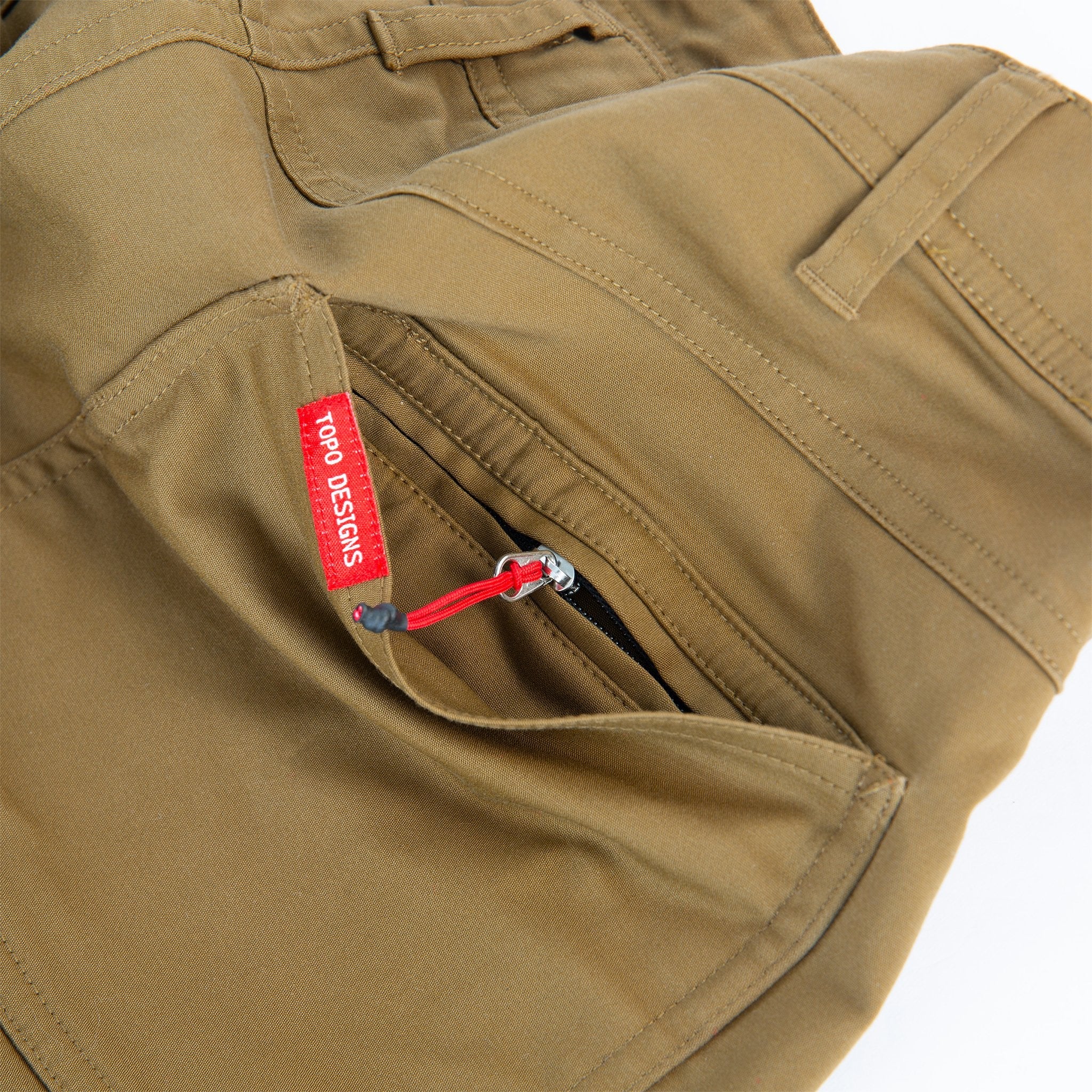 Topo Designs Men's Global Pants lightweight cotton nylon travel pants in Dark Khaki brown showing hidden zipper back pocket.