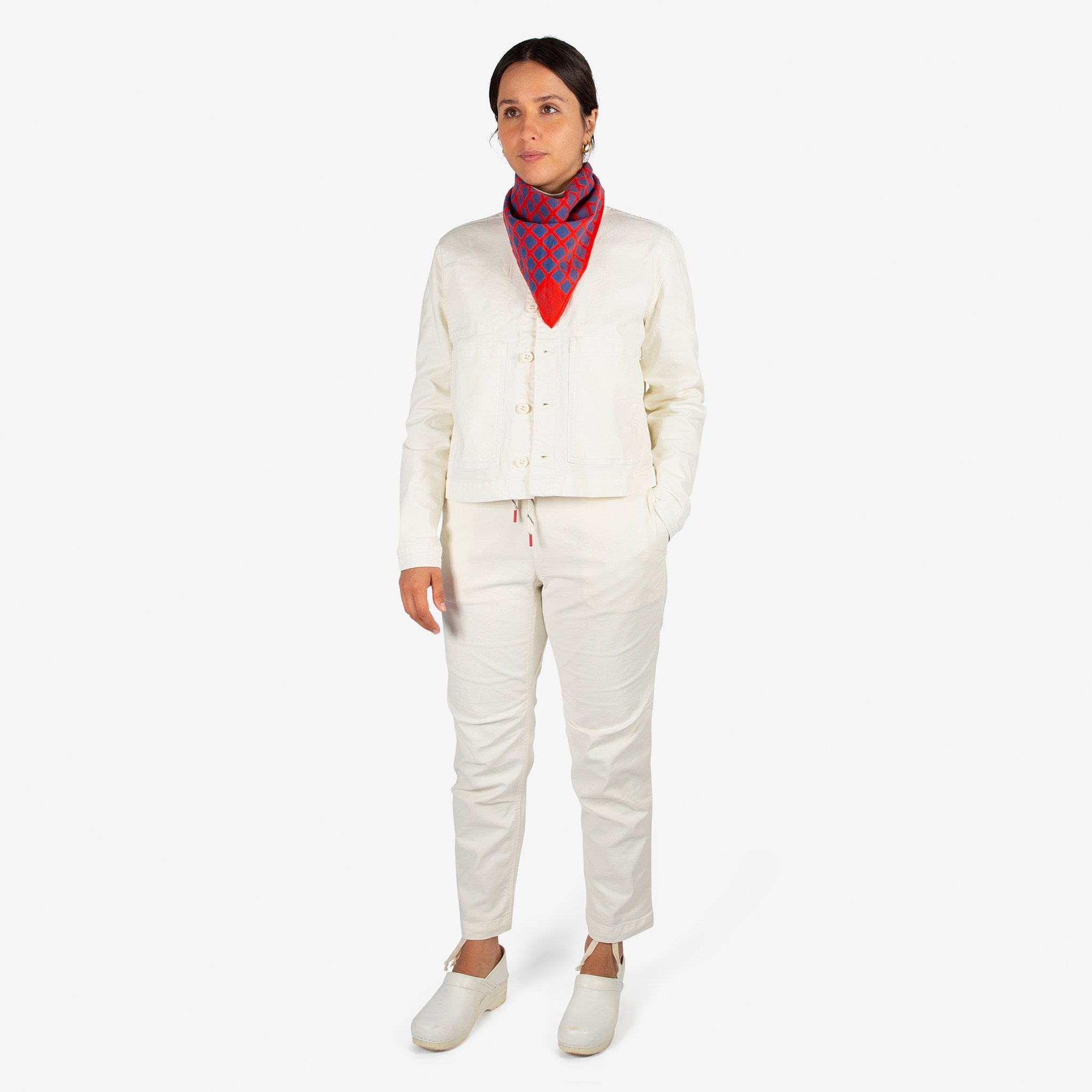 Front model shot of Topo Designs Women's Dirt Jacket & Pants in Natural white.