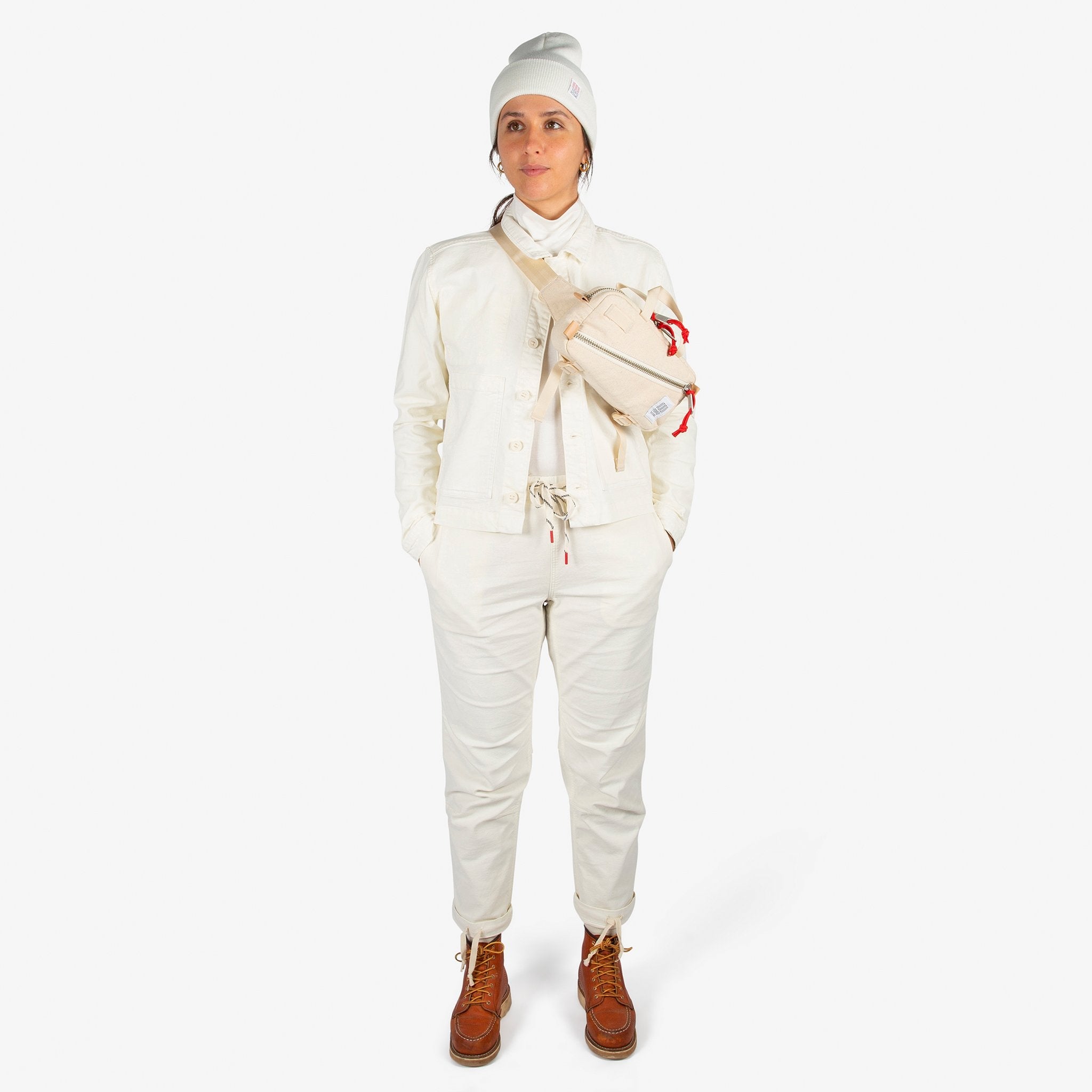 Front model shot of Topo Designs Women's Dirt Jacket & Pants in Natural white.