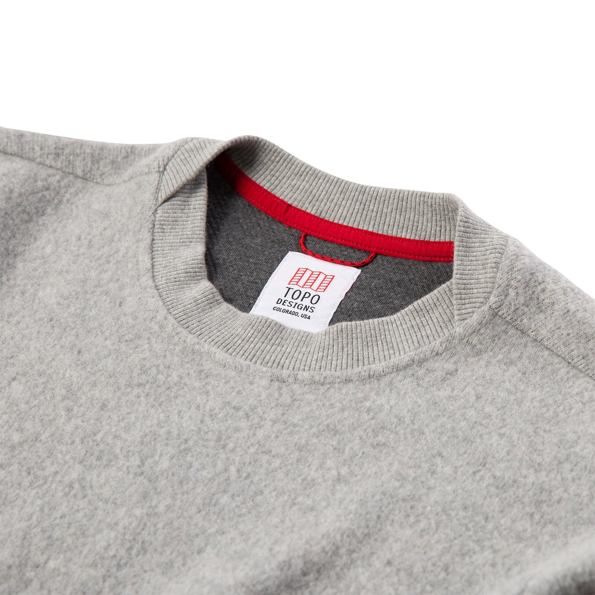 General detail shot of women's global sweater in gray showing neck hem.