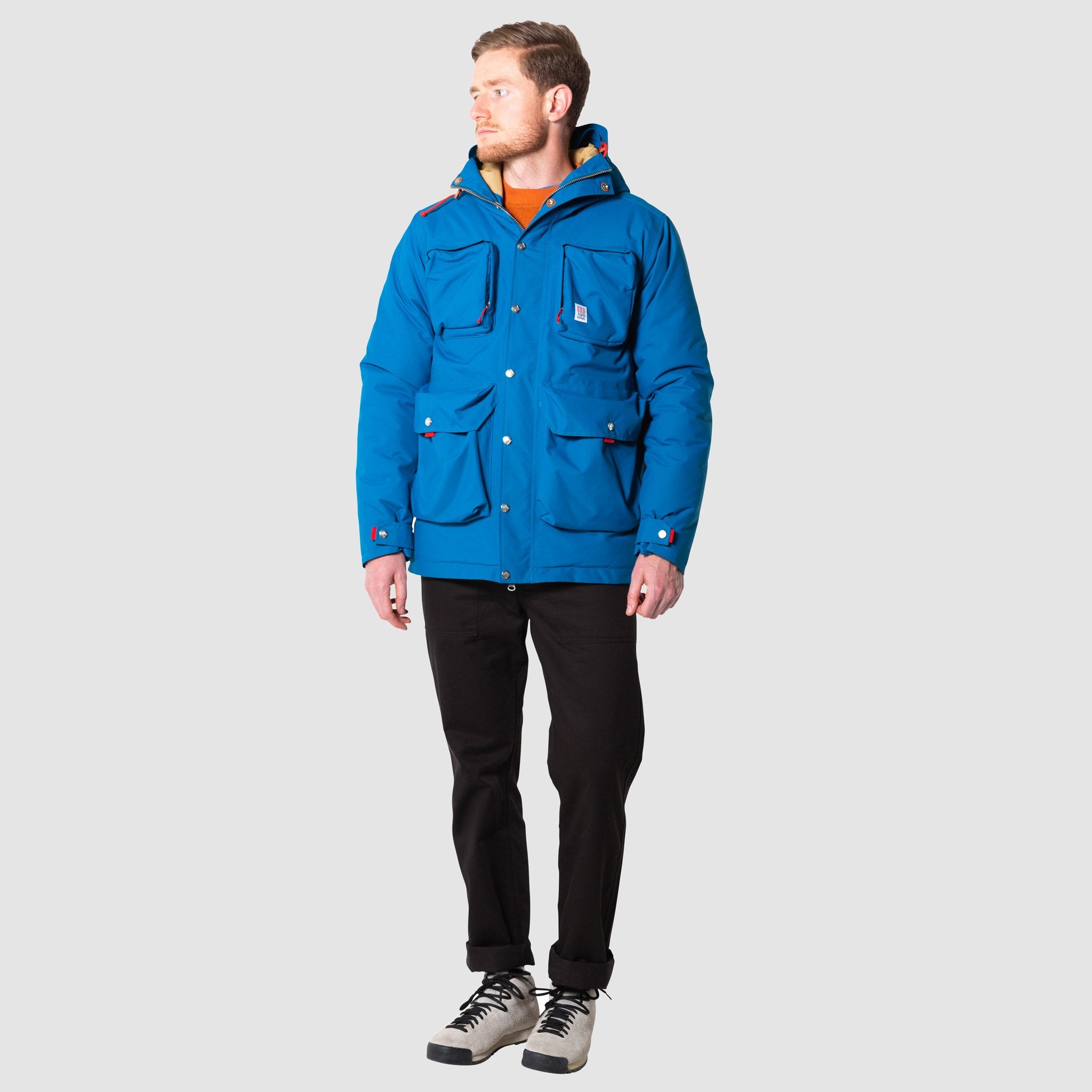 Full body front model shot of men's mountain jacket in blue, zipped