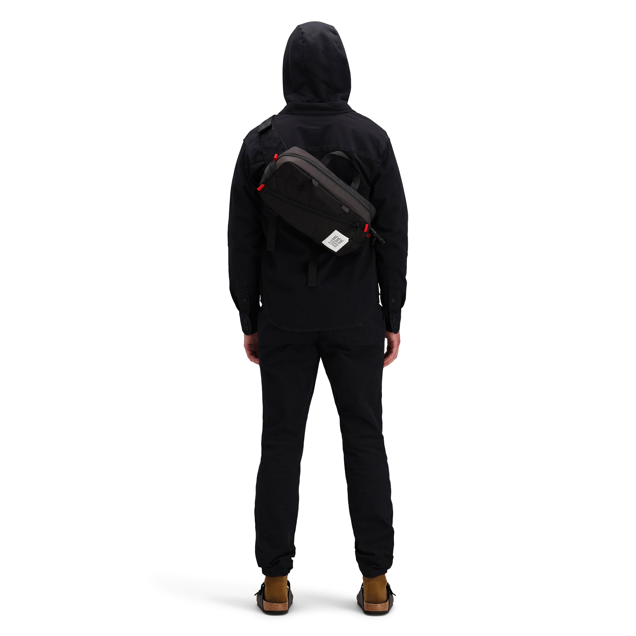 Back model shot of Topo Designs Men's Dirt Hoodie 100% organic cotton French terry sweatshirt in "black".