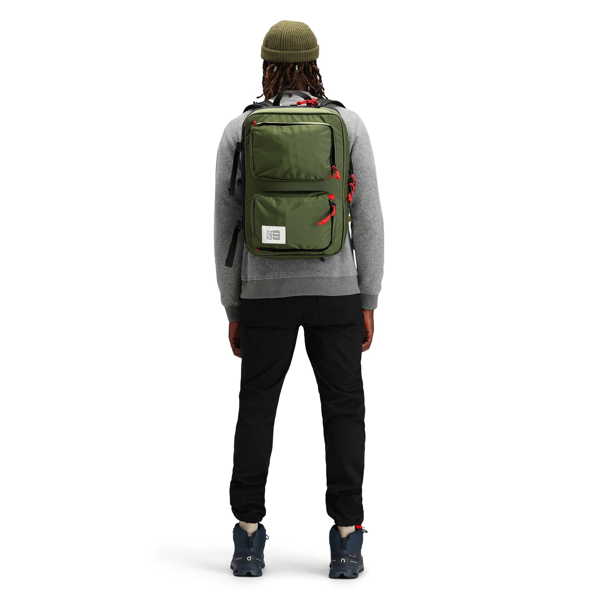 General back model shot of Topo Designs Global Briefcase convertible laptop travel backpack in "Olive" green nylon.