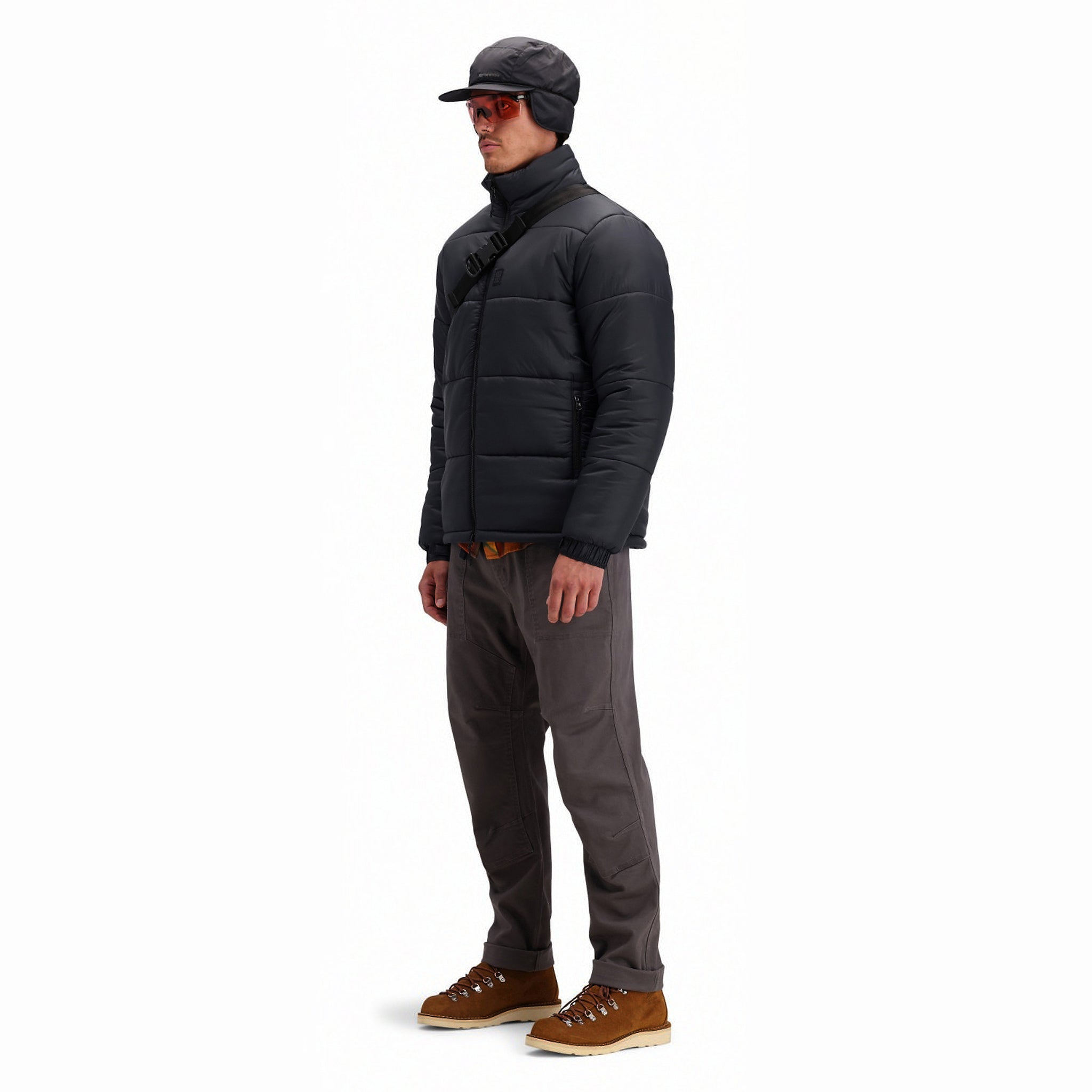 Front model shot of Topo Designs Men's Puffer recycled insulated Jacket in "Black"