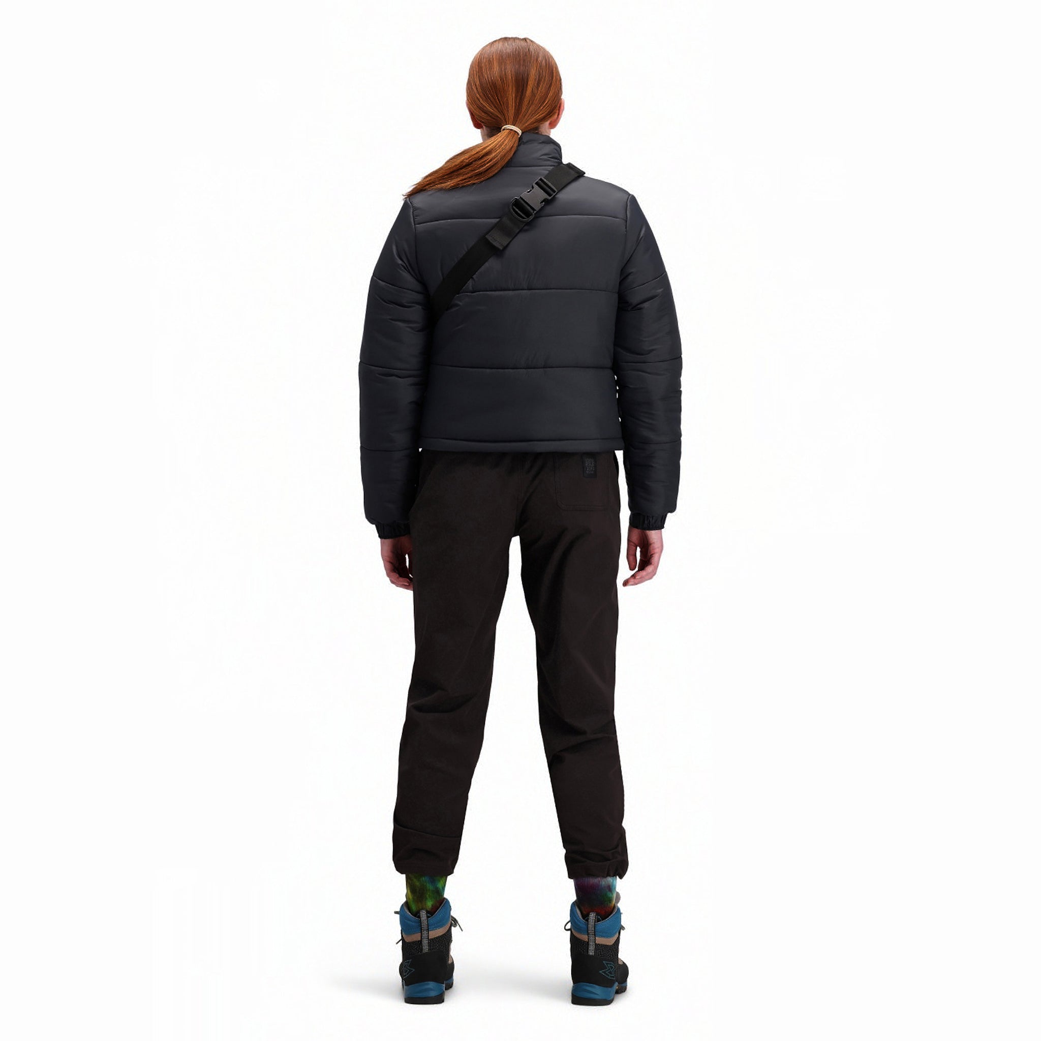 Back model shot of Topo Designs Women's Puffer recycled insulated Jacket in "Black"