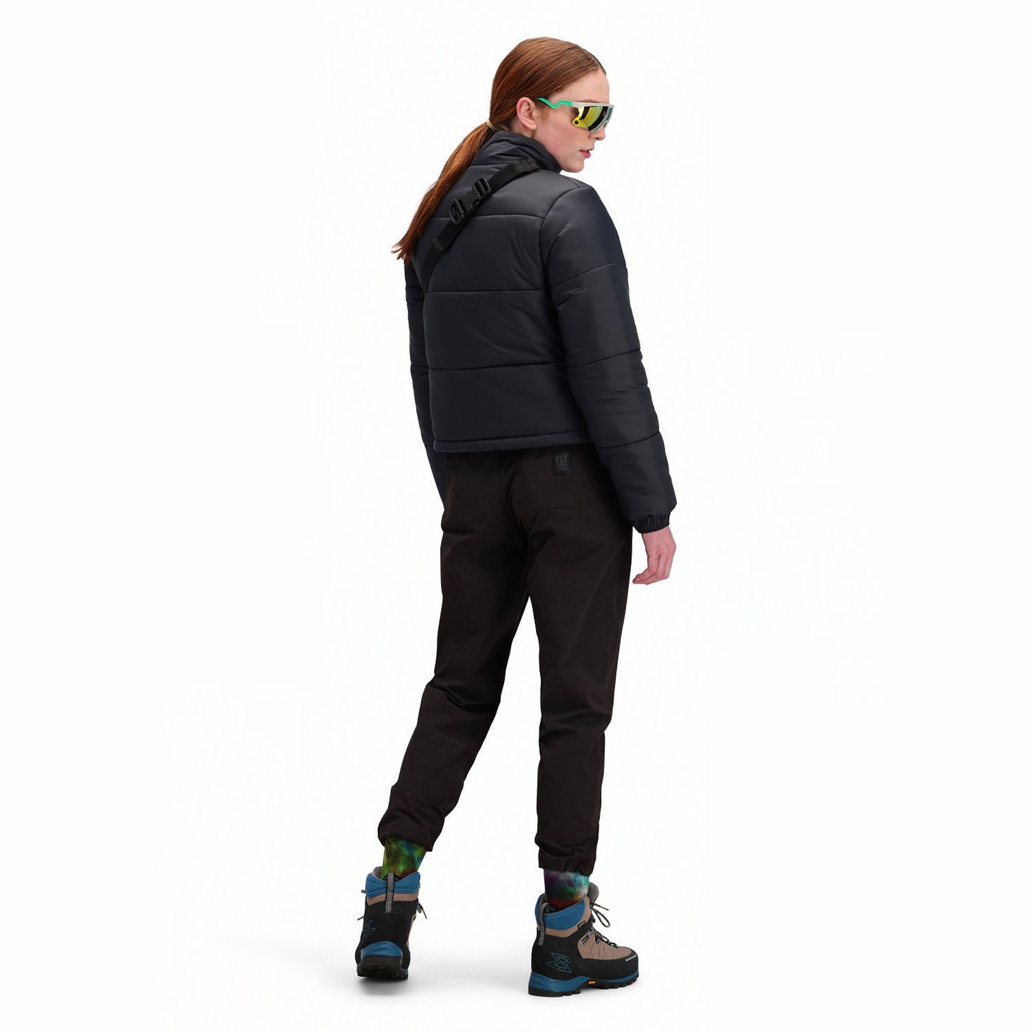 Back model shot of Topo Designs Women's Puffer recycled insulated Jacket in "Black"