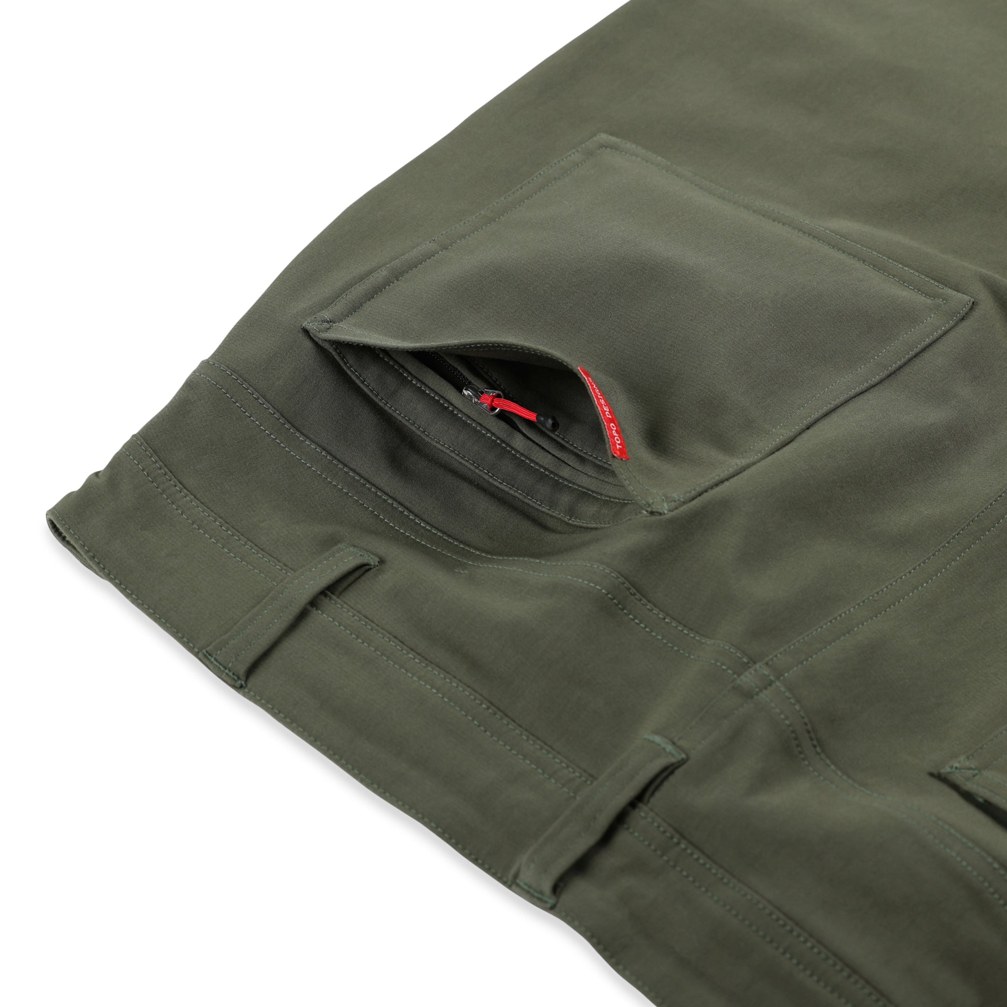 Hidden back zipper pocket on Topo Designs Men's Global Pants lightweight cotton nylon travel pants in olive green.